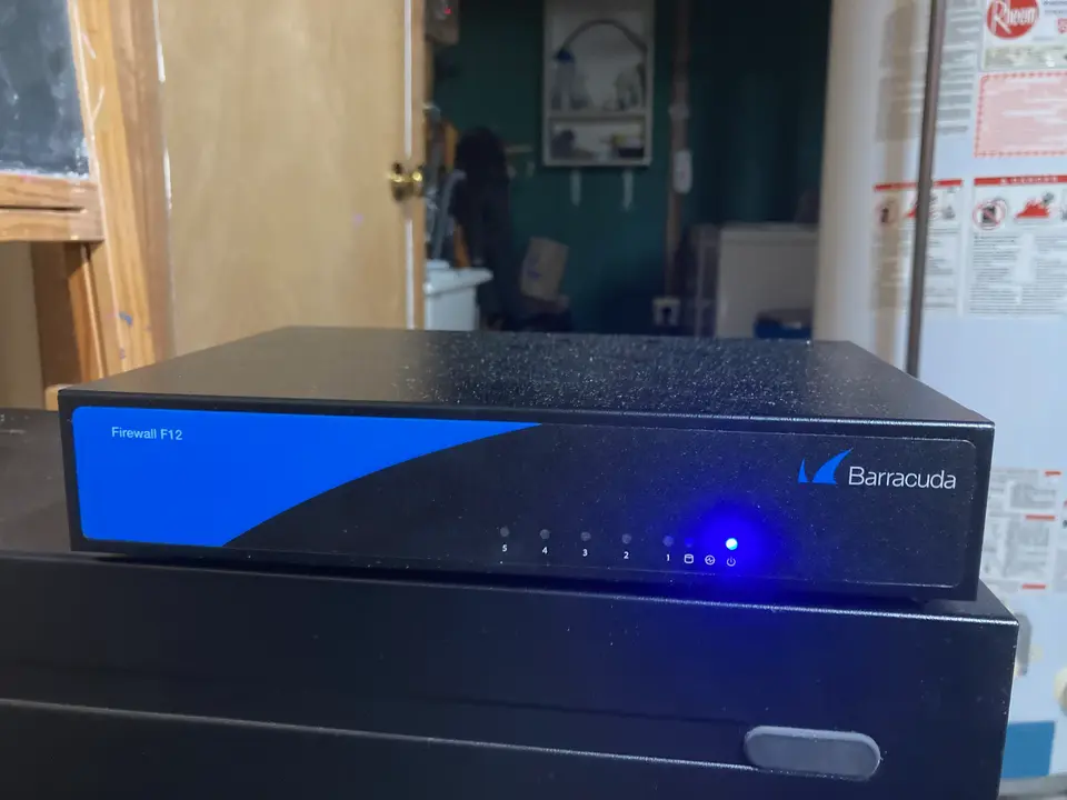 front of a small rectangular router with lights shining