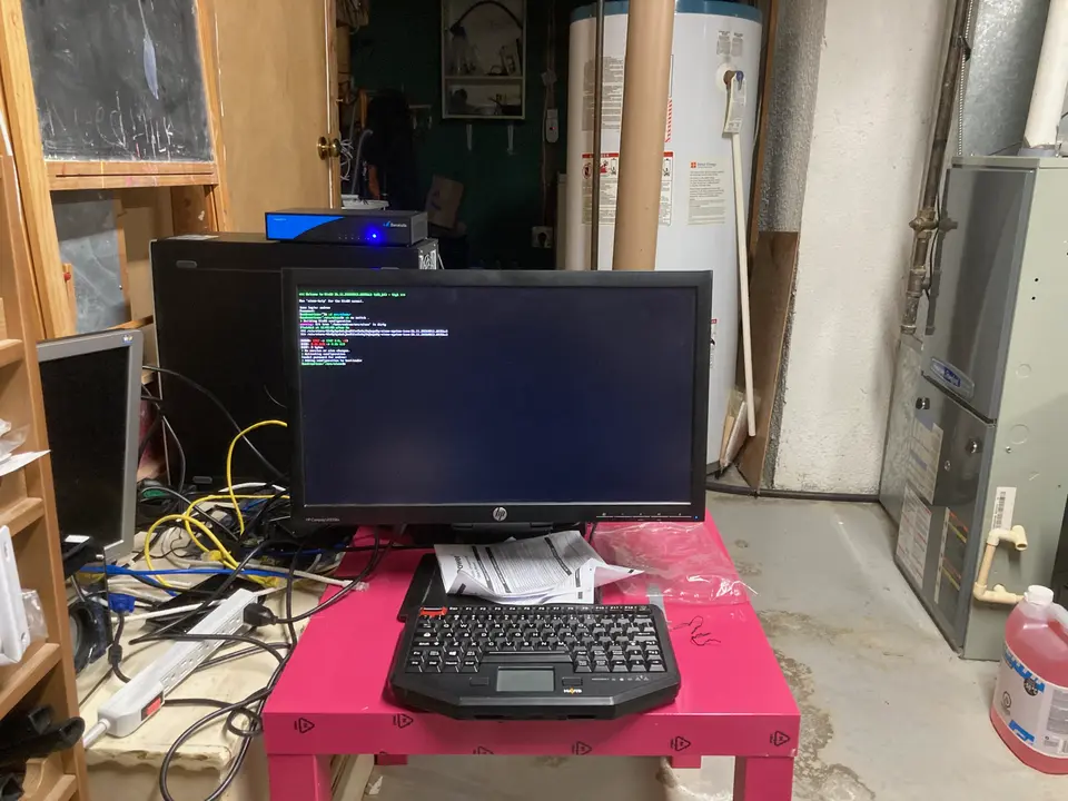 The black and blue small box is my home router running OpenBSD, and below it is my NixOS box that runs most services.